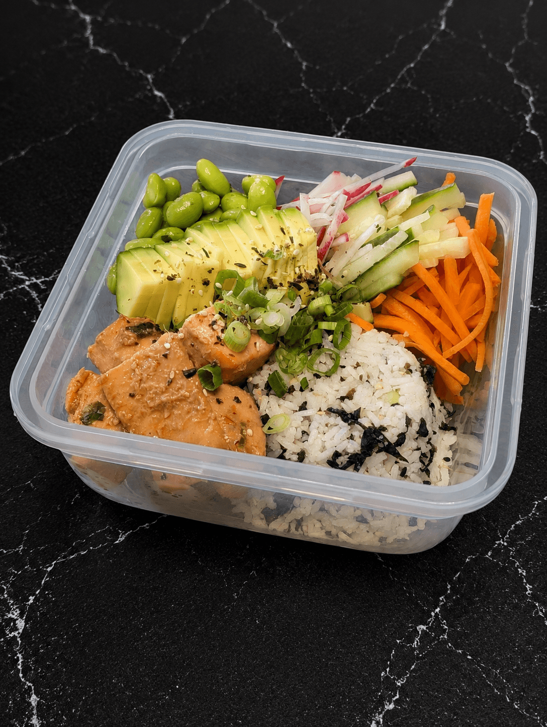 Salmon sushi bowl with avocado, edamame and seasoned rice